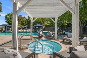 A pool with a waterfall in the middle of it.